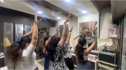 Isha teaching a dance routine to a group